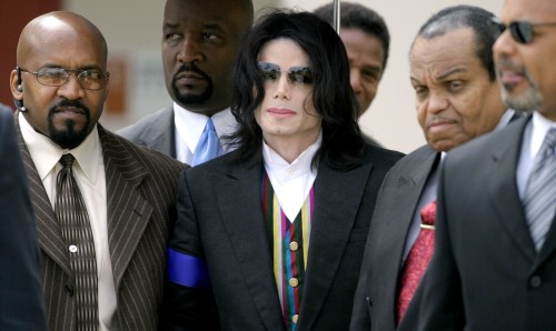 SANTA MARIA, CA - MARCH 21:  US Pop Star Michael Jackson is escorted by three security personnel and